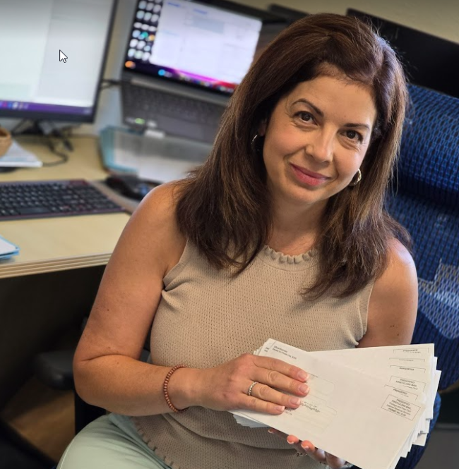 Elizabeth Samaniego with a bunch of IRS letters