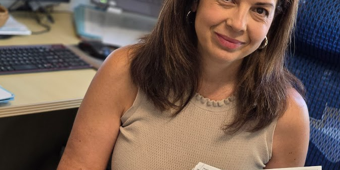 Elizabeth Samaniego with a bunch of IRS letters